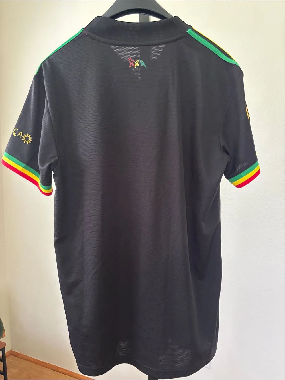 adidas Kids Black Ajax Jersey with Red Logos and Rasta Trim